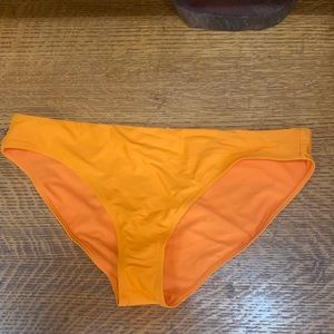 Orange Athleta swim suit bottoms